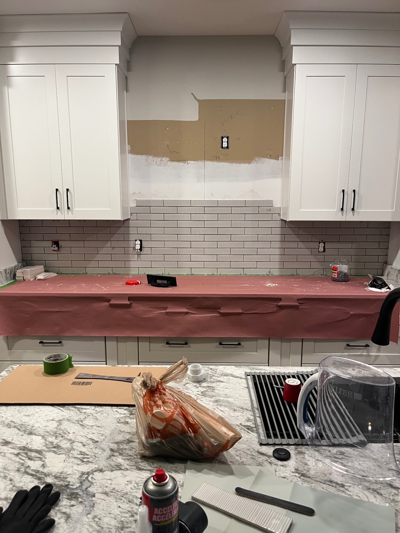 Stacked subway tile backsplash in progress