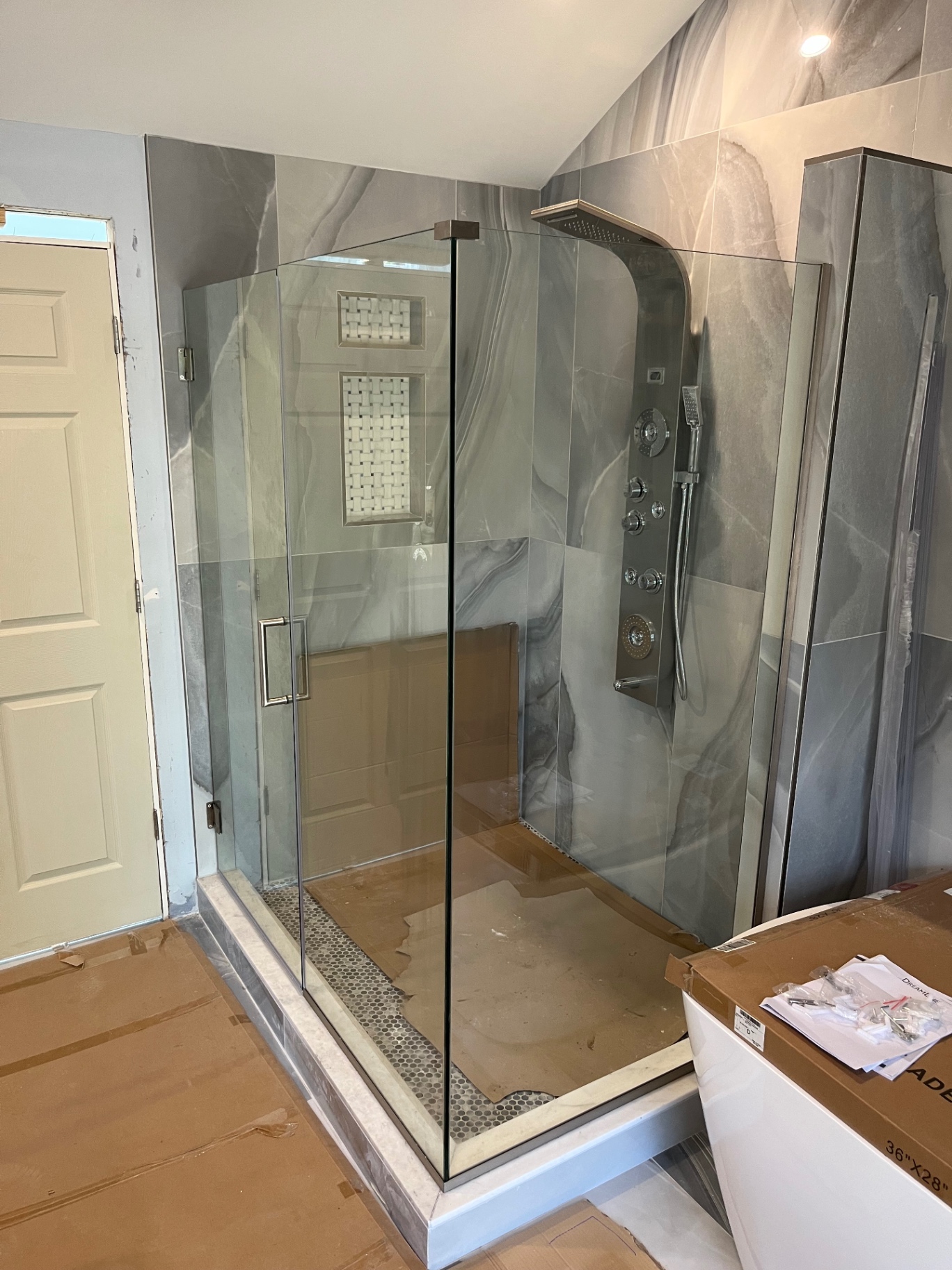 Marble-tiled walk-in shower