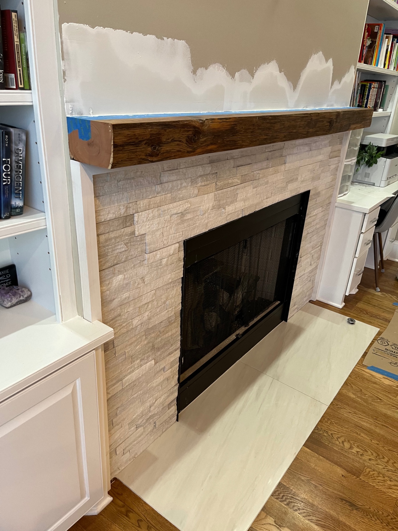 Stone fireplace & live-edge mantel detail