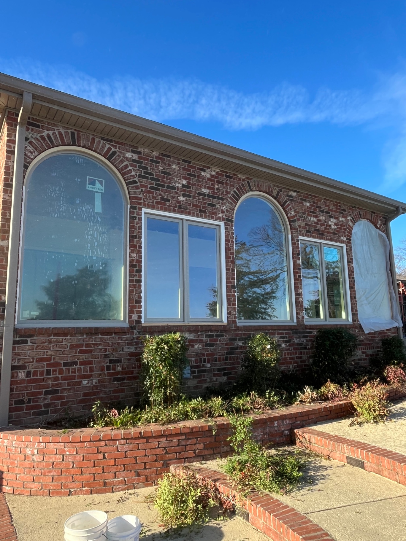 Andersen arched windows on brick