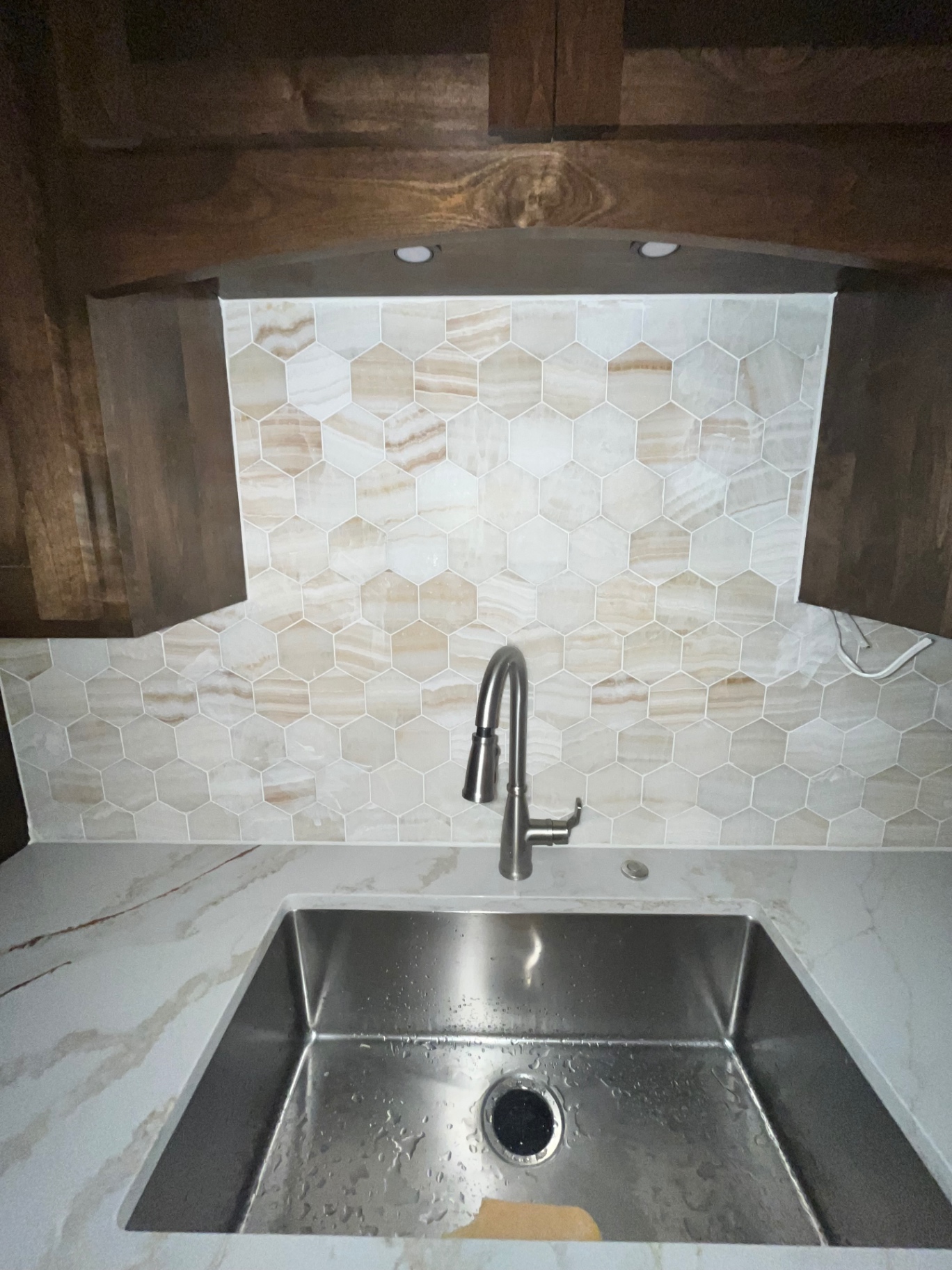 Onyx hexagon backsplash — sink detail